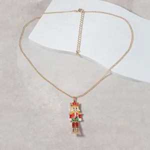 Golden Nutcracker soldier pendant necklace with colorful enamel on stone tray