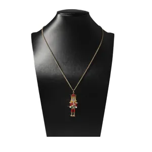 Nutcracker soldier pendant necklace with colorful enamel and pearl accents on gold chain