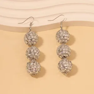 Sparkly silver disco ball drop earrings with three tiered mirror beads on fishhooks