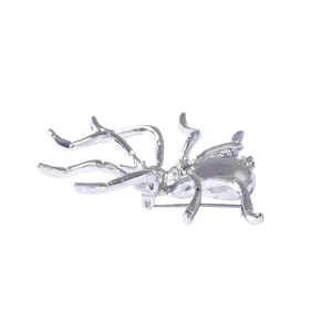 Silver spider brooch with sparkling crystals on back for a unique fashion jewelry look