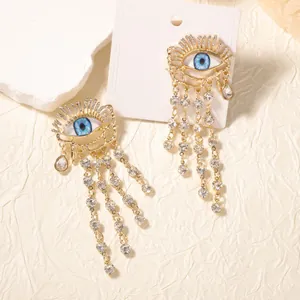 Κομψά χρυσά σκουλαρίκια Evil Eye με μακριά κρόσσια και λαμπερούς κρυστάλλους