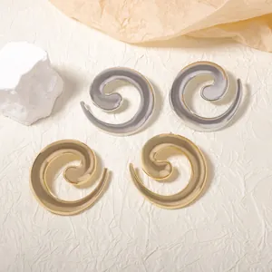 Orecchini a spirale in oro e argento lucido dal design geometrico vintage in metallo
