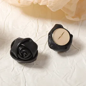 French style black leather rose stud earrings with golden base and textured petals