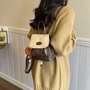 Retro contrast color mini backpack for women with cute lion plush pendant on model