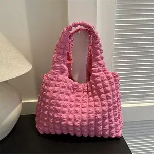 Pink popcorn textured tote bag with a minimalist ruffled design and large capacity