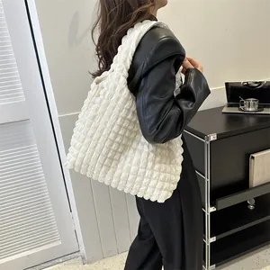 Minimalist white bubble textured tote bag with wide strap for casual office use