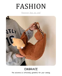 Brown corduroy dumpling bag with a mini pouch and a yellow star plush toy charm