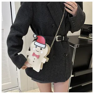 Crossbody gingerbread man Christmas bag with gold chain strap and cute festive design