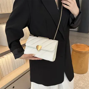 Chic quilted beige crossbody bag with gold heart clasp and chain strap for women