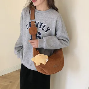 Brown corduroy crescent crossbody bag with small coin purse and star plush pendant