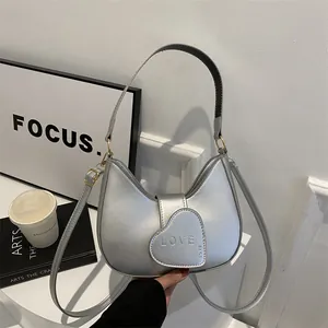 Chic silver half-moon shoulder bag with heart-shaped LOVE buckle for women