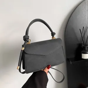 Dark grey gradient leather handbag with envelope flap and twisted handle detail