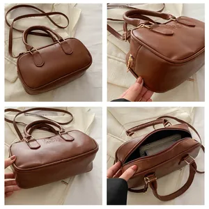 Detail of brown PU leather handbag showing texture, fashion relief and interior space