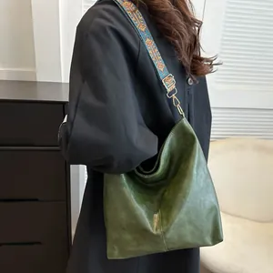 Dark green hobo shoulder bag with vintage texture and embroidered wide strap