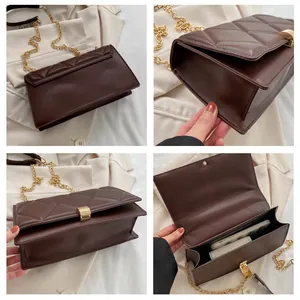 Detail view of brown quilted crossbody bag with gold square buckle and chain strap