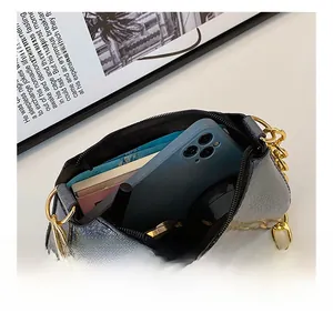 Detailed interior view of silver glitter shoulder bag showing storage for phone and wallet