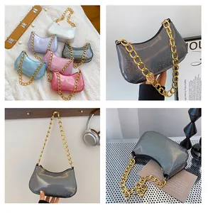 Macro view of metallic shiny PU leather colors and chunky gold chain strap details