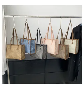 Minimalist vintage tote bags in six colors with crinkled texture and metallic rivets
