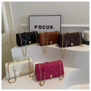 Group shot of quilted crossbody bags in five colors with gold chain straps and metal locks