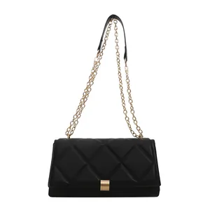 Classic black quilted crossbody bag with gold chain strap and metallic clasp closure