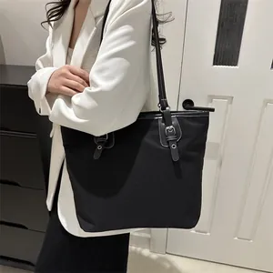 Minimalist large canvas tote bag with contrast stitching and silver metal hardware
