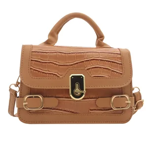 Modische braune Handtasche mit Krokodilmuster und Metalldrehverschluss für Damen