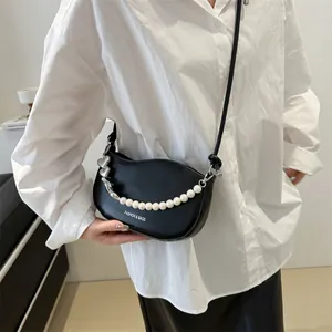 Chic black crescent hobo bag with pearl chain and heart pendant for women