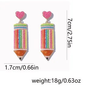 Detailed dimensions of handmade beaded pencil earrings with cute pink heart and size labels