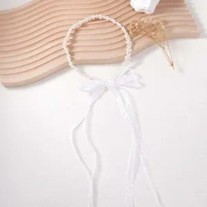 Elegant white faux pearl headband with sheer organza bow and long ribbons