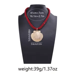 Detailed view of sea shell pendant necklace with size specs on red woven rope