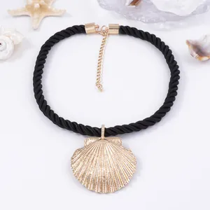 Minimalist alloy shell pendant necklace with a black braided cord on a summer beach theme