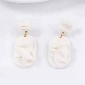 Elegant white matte geometric petal drop earrings with textured pleats and gold rings