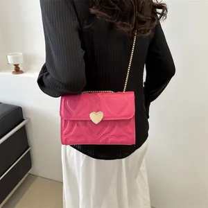 Pink heart quilted small crossbody chain bag with golden heart buckle for women