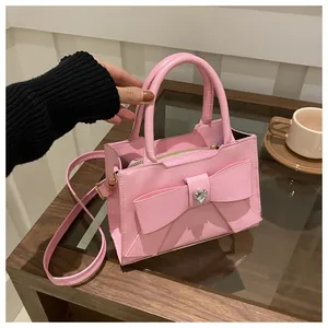 Rosa Handtasche mit Schleife, Herz-Strass und verstellbarem Riemen im modernen Design