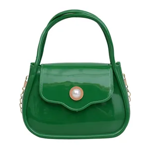 Green jelly handbag for kids featuring pearl clasp and gold metal chain strap