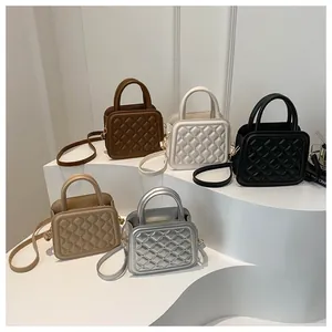 Detailed row of quilted mini crossbody bags in brown, cream, black, beige, and silver colors