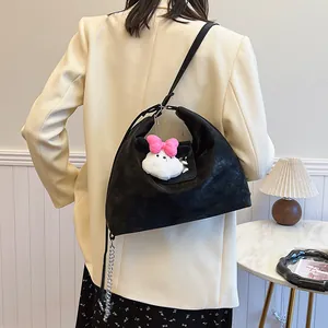 Minimalist black matte hobo bag with cute rabbit pendant and adjustable shoulder strap