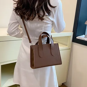 Classic dark brown leather tote bag for women with minimalist shoulder strap style