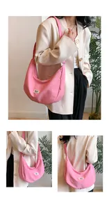Detailed views of a pink crescent nylon crossbody bag showing the fabric and logo