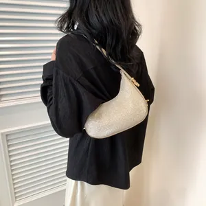 Sparkling silver hobo shoulder bag for women with golden metal buckle and crescent shape