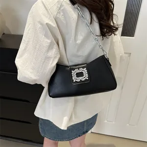 Fashionable black leather underarm bag with silver chain strap and square crystal buckle