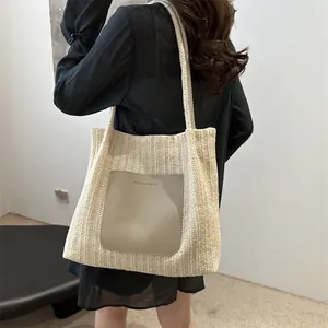 Women's cream straw tote bag with large capacity and front leather pocket detail