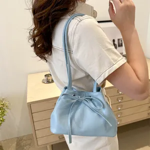 Minimalist light blue PU leather shoulder bucket bag with decorative bow detail