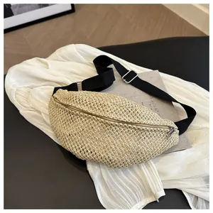 Detail shot of beige woven fiber texture and metal zipper on this stylish chest bag