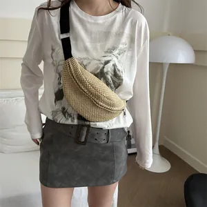 Fashionable beige woven straw crossbody chest bag with adjustable black wide strap
