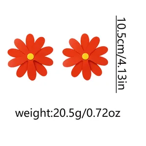 Detailed size view of oversized bright orange daisy earrings with dimensions and weight info