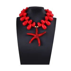 Close-up of red chunky starfish pendant necklace on mannequin for a resort vacation look