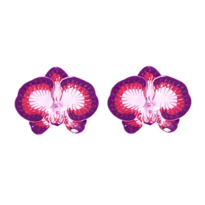 Detailed view of purple orchid stud earrings with realistic enamel floral petals