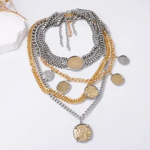 Multi-layer gold and silver mixed chain necklace with textured round coin charms