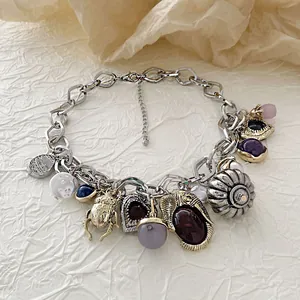 Vintage bohemian layered necklace with gold beetle charm and colorful gemstone pendants